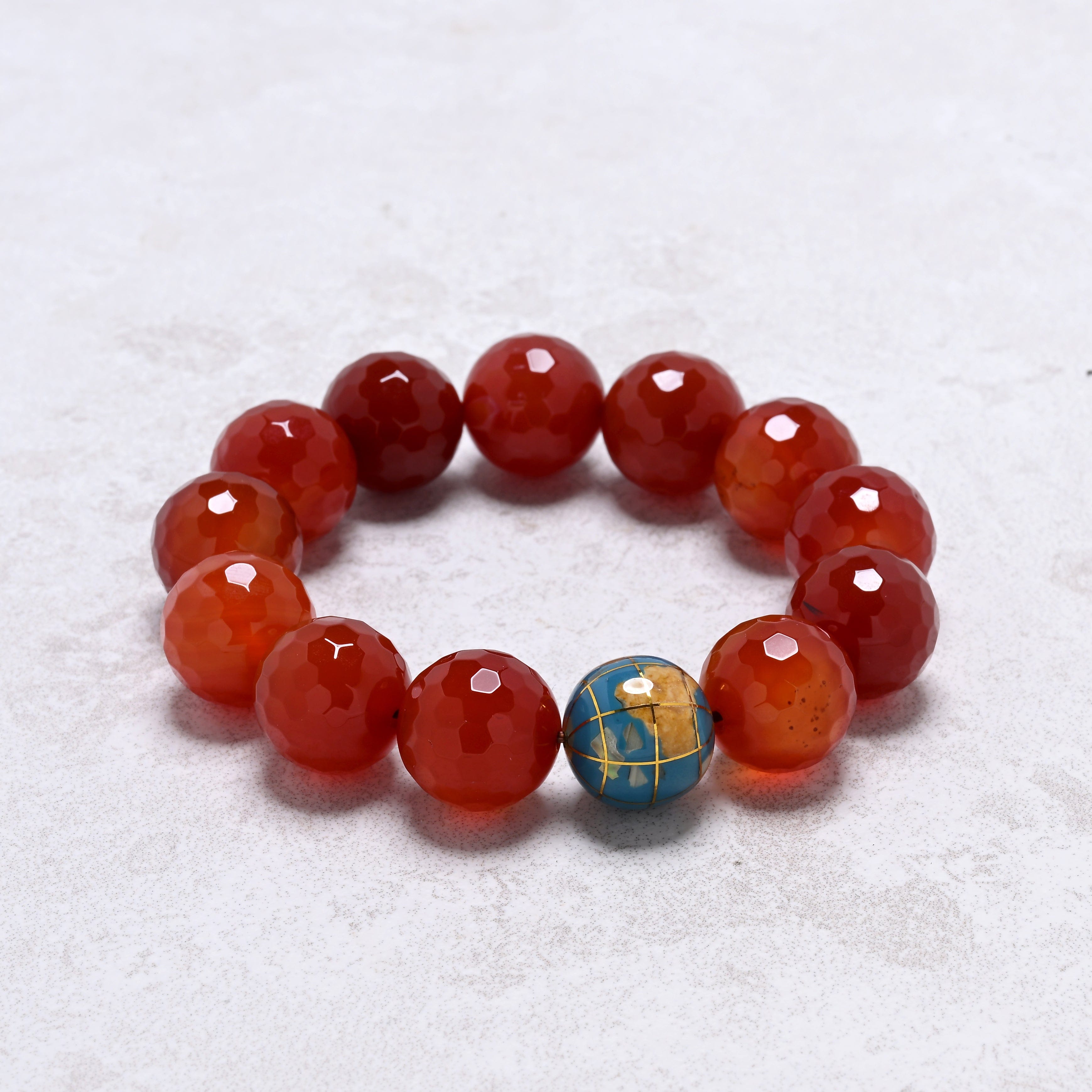 KALIFANO Gemstone Jewelry 16mm Carnelian Gemstone Elastic Bracelet with Blue Globe Accent Bead