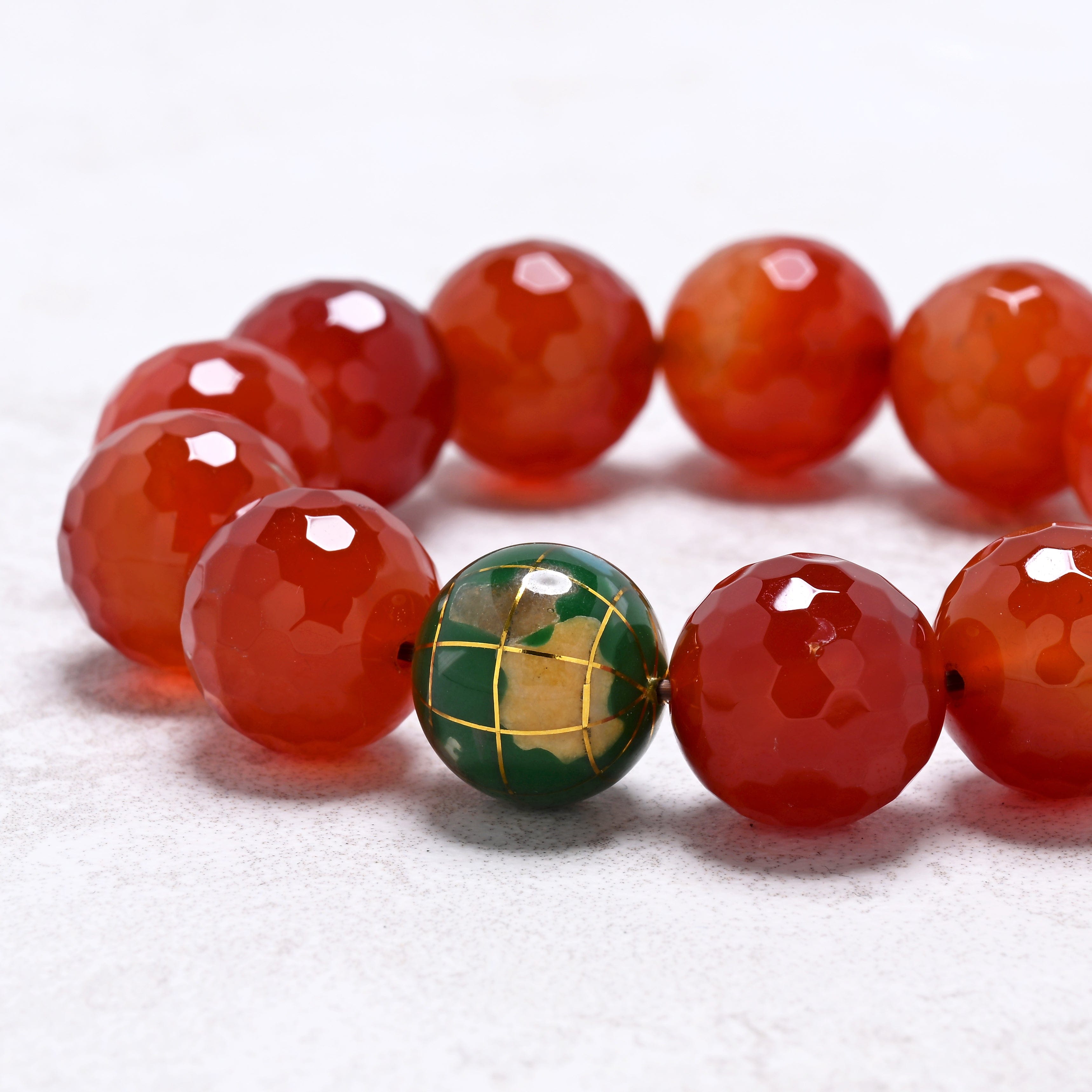KALIFANO Gemstone Jewelry 16mm Carnelian Gemstone Elastic Bracelet with Green Globe Accent Bead