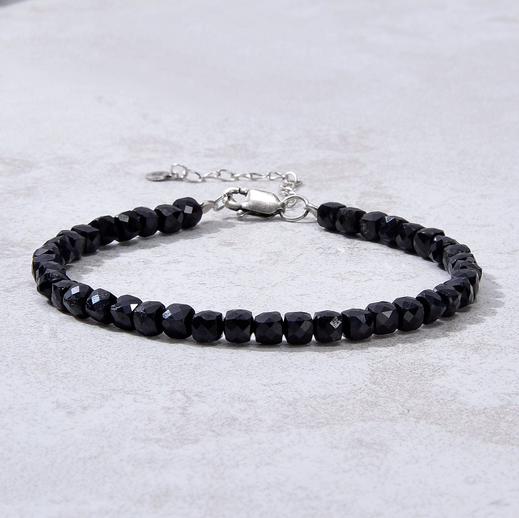 KALIFANO Gemstone Jewelry Natural Black Tourmaline Faceted 4mm Barrel Bracelet with Sterling Silver Extender B4-16S-BT