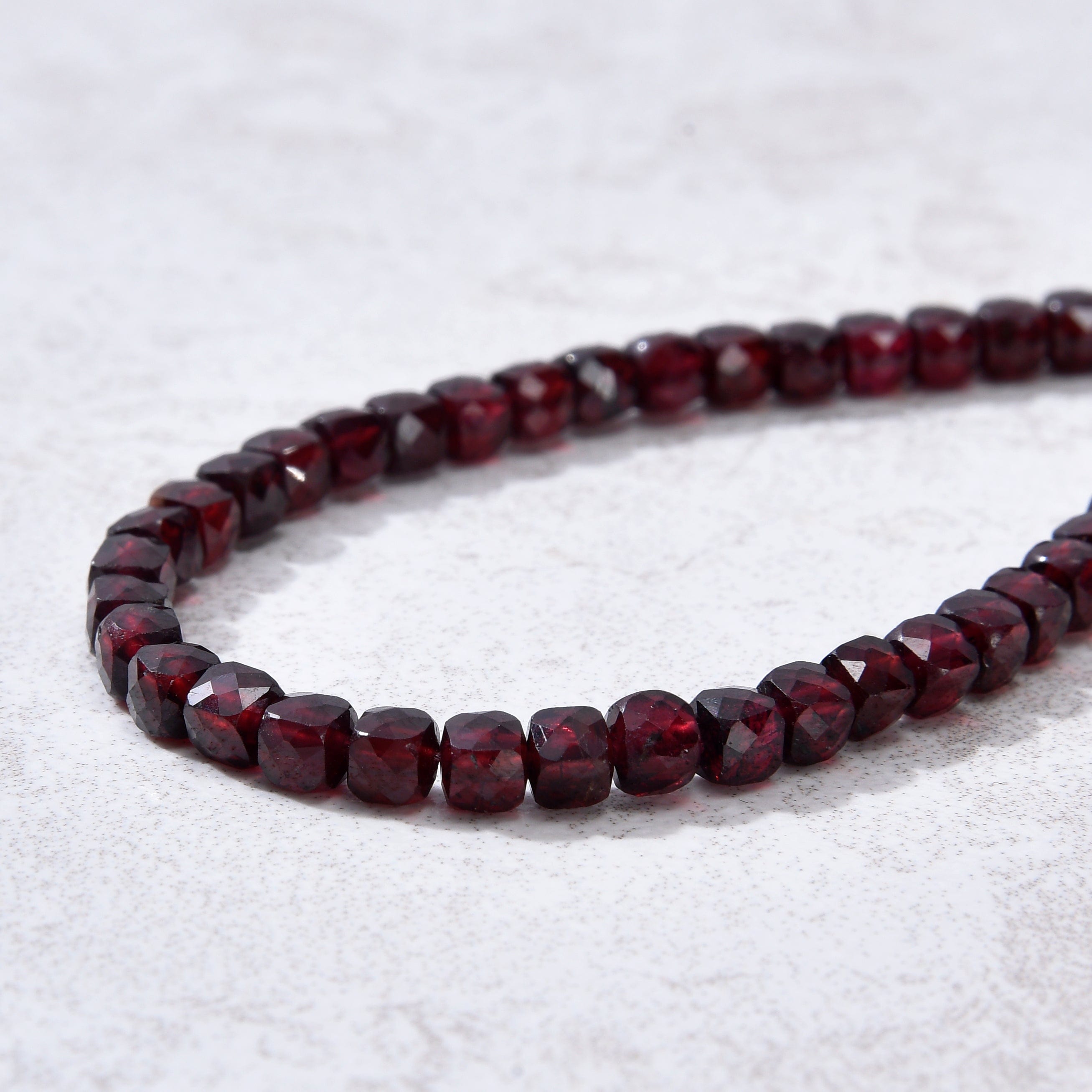 KALIFANO Gemstone Jewelry Natural Garnet Faceted 4mm Barrel Bracelet with Sterling Silver Extender B4-16S-GA