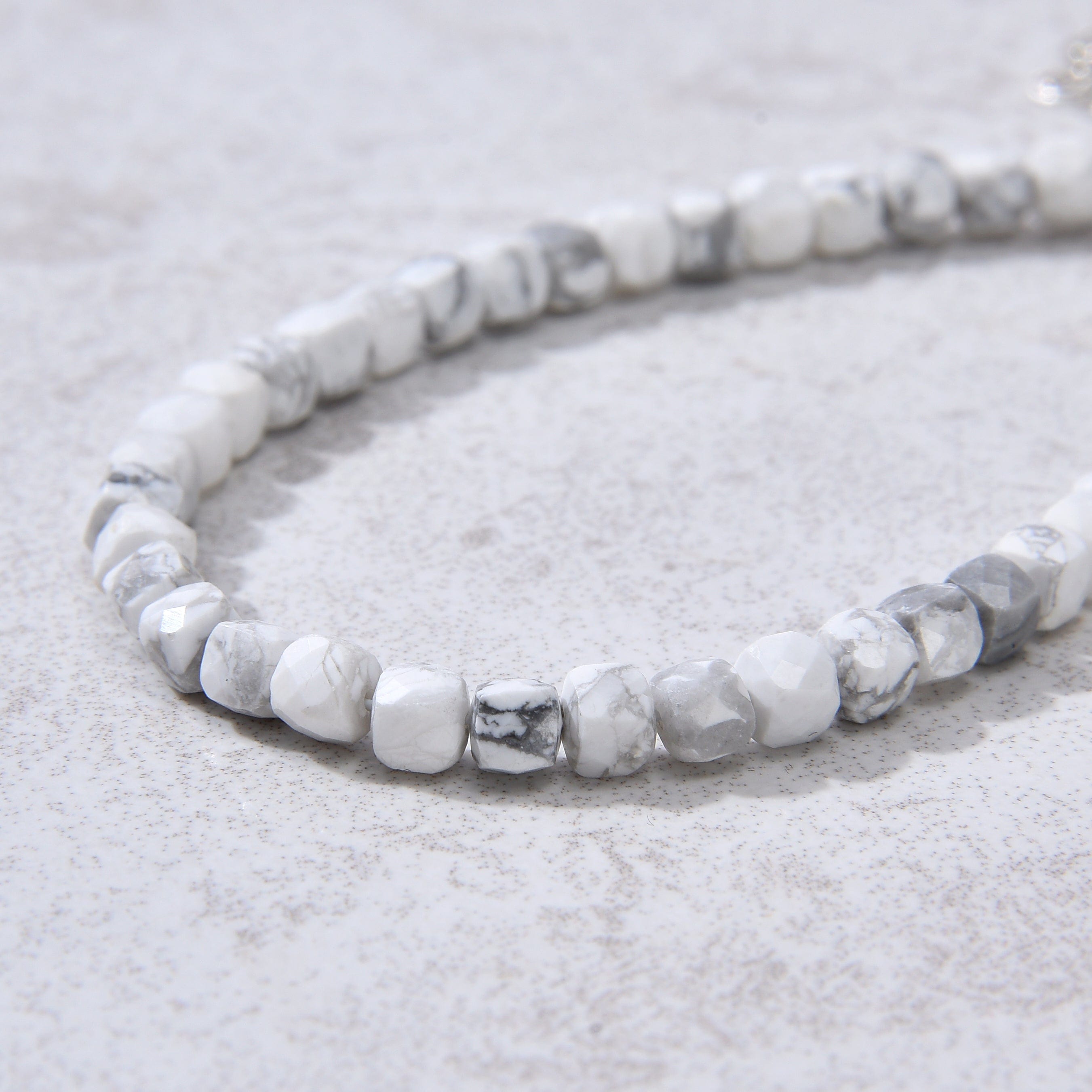 KALIFANO Gemstone Jewelry Natural Howlite Faceted 4mm Barrel Bracelet with Sterling Silver Extender B4-16S-HT
