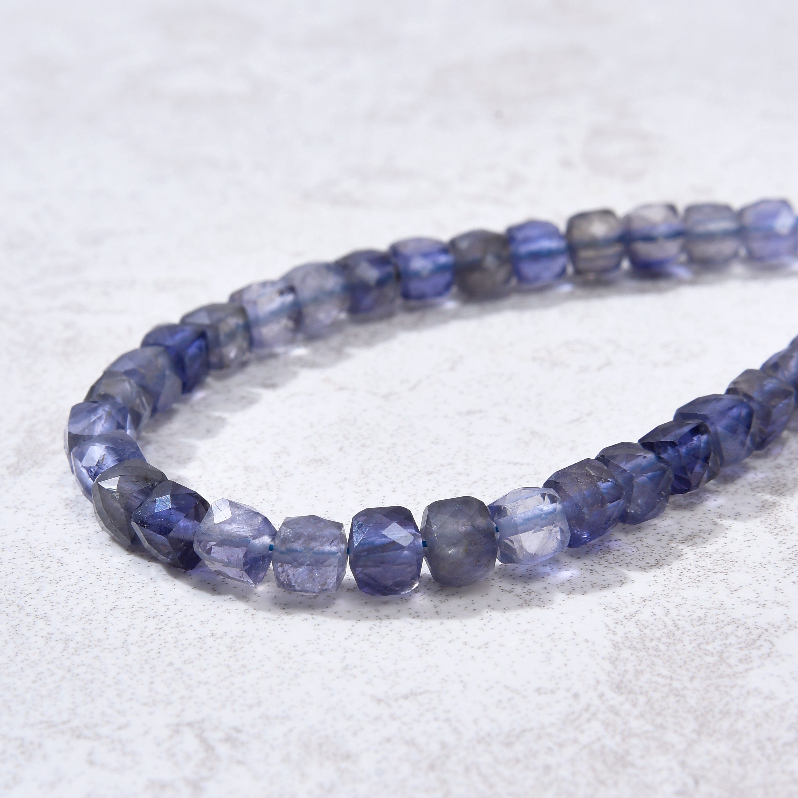 KALIFANO Gemstone Jewelry Natural Iolite Faceted 4mm Barrel Bracelet with Sterling Silver Extender B4-16G-IO
