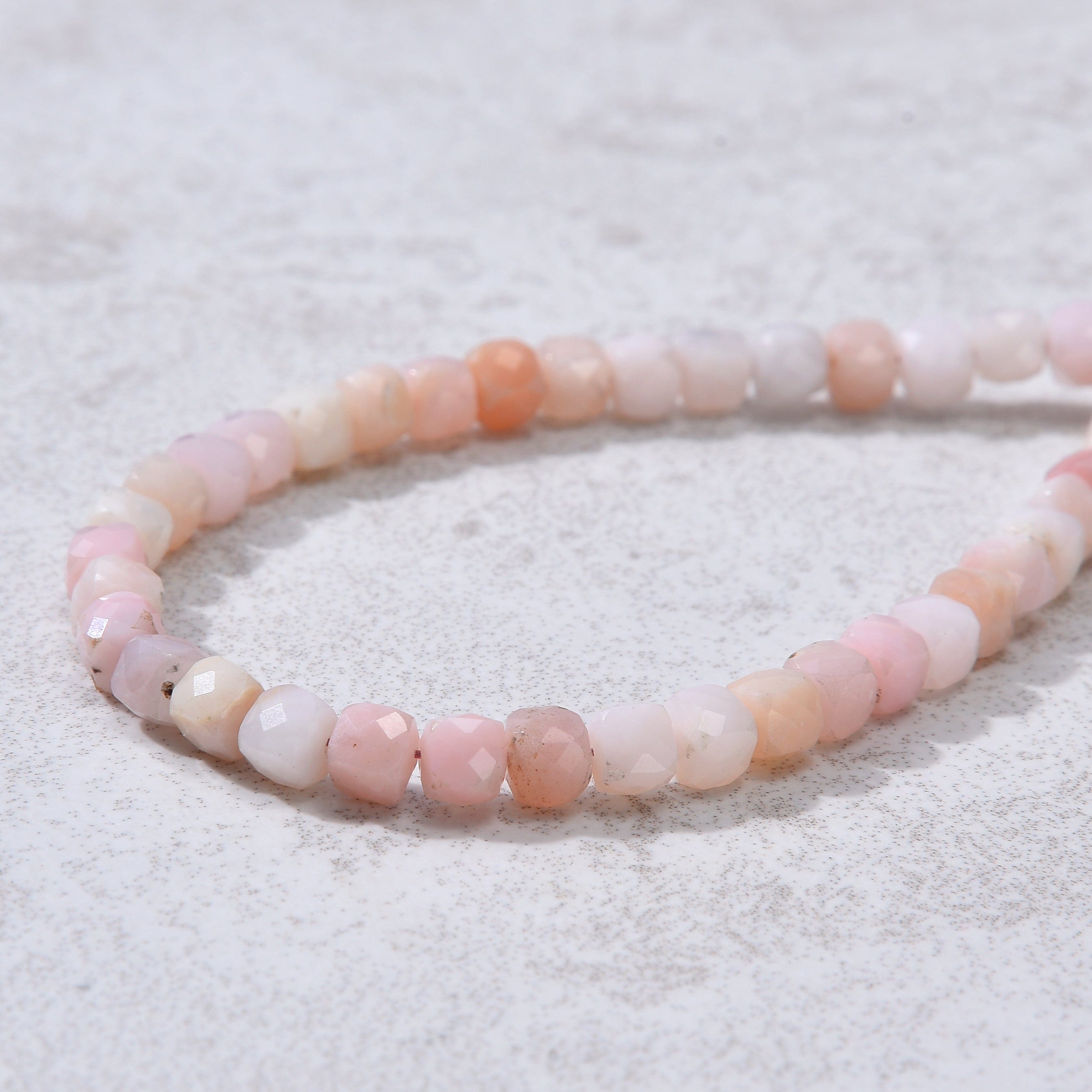 KALIFANO Gemstone Jewelry Natural Pink Opal Faceted 4mm Barrel Bracelet with Sterling Silver Extender B4-16G-PO