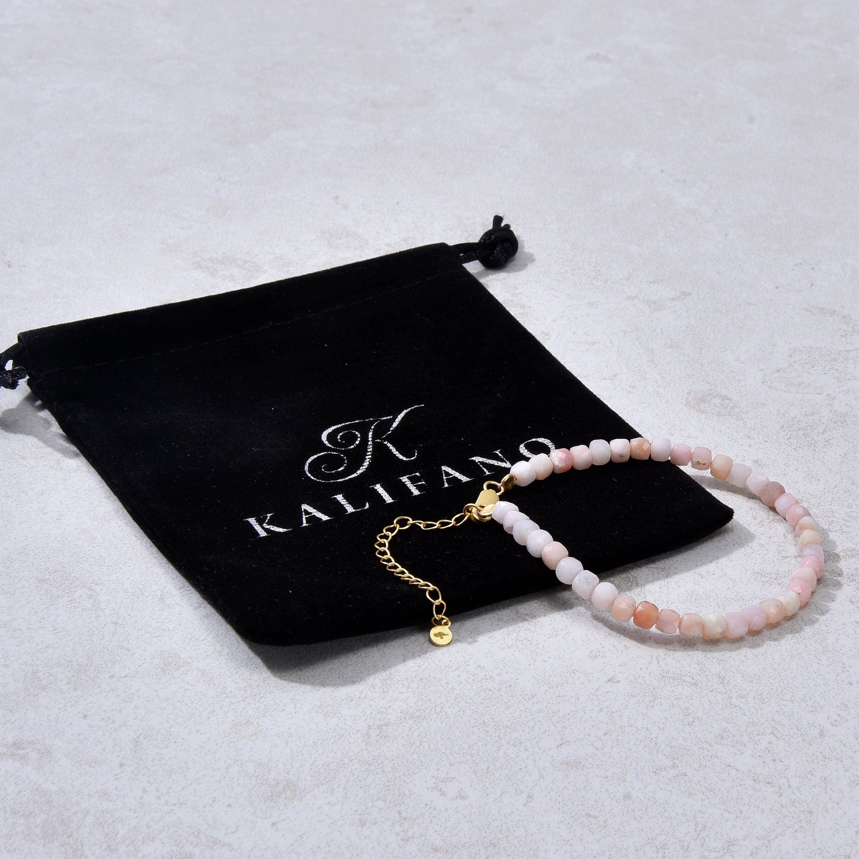 KALIFANO Gemstone Jewelry Natural Pink Opal Faceted 4mm Barrel Bracelet with Sterling Silver Extender B4-16G-PO