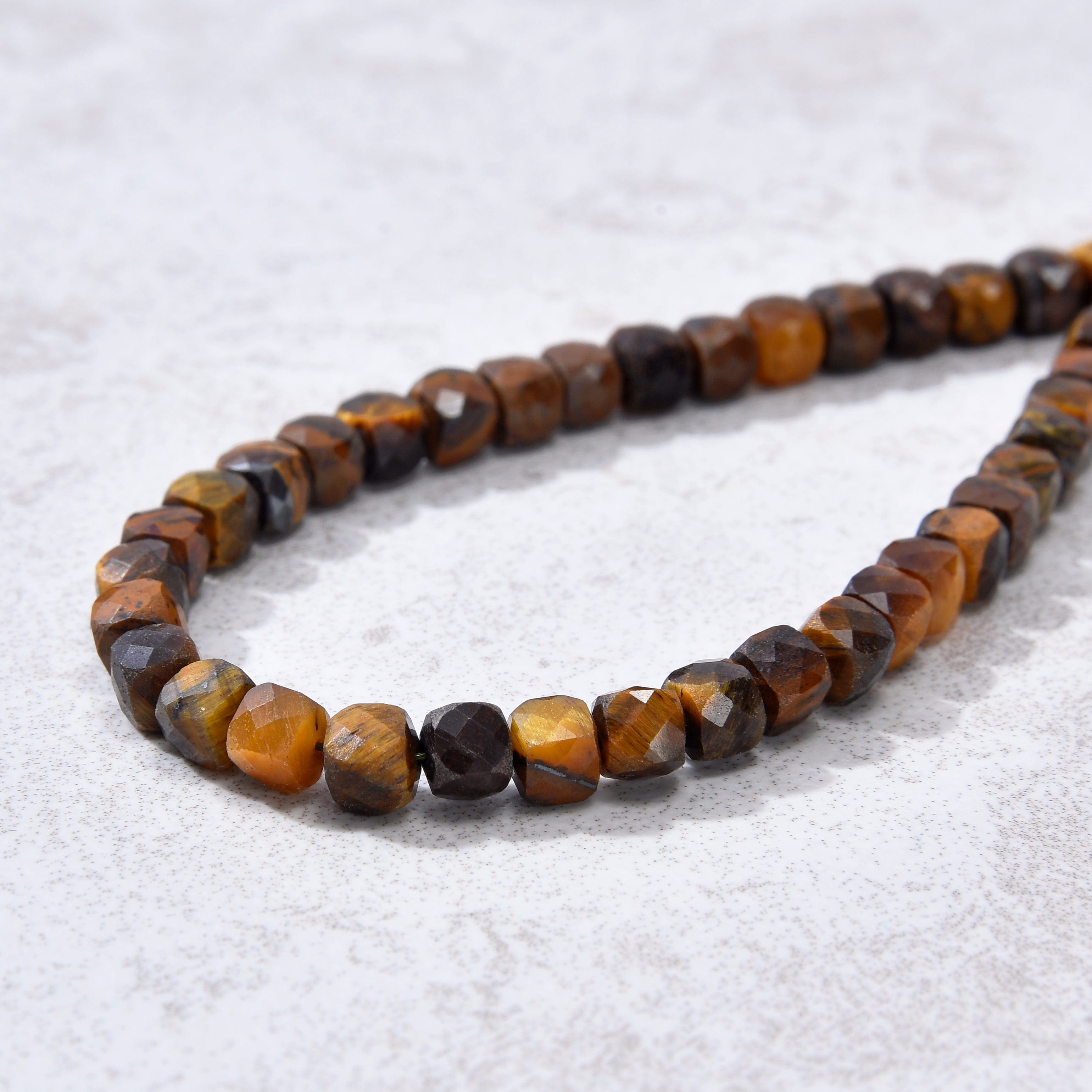 KALIFANO Gemstone Jewelry Natural Tiger Eye Faceted 4mm Barrel Bracelet with Sterling Silver Extender B4-16S-TE