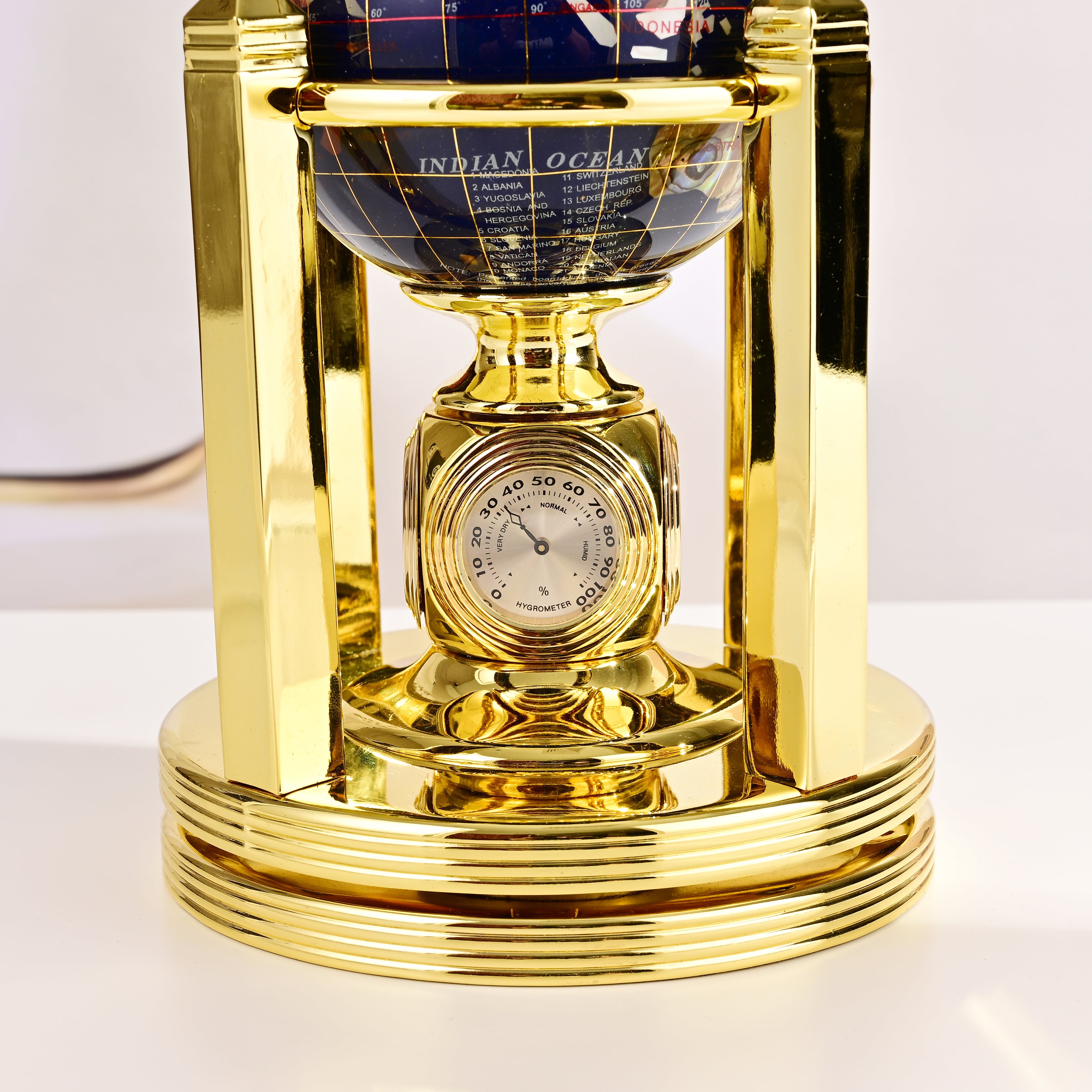 8.5" Tall Gemstone Globe with 5" Lapis Ocean on 24k Gold Plated Bi-directional rotating Stand