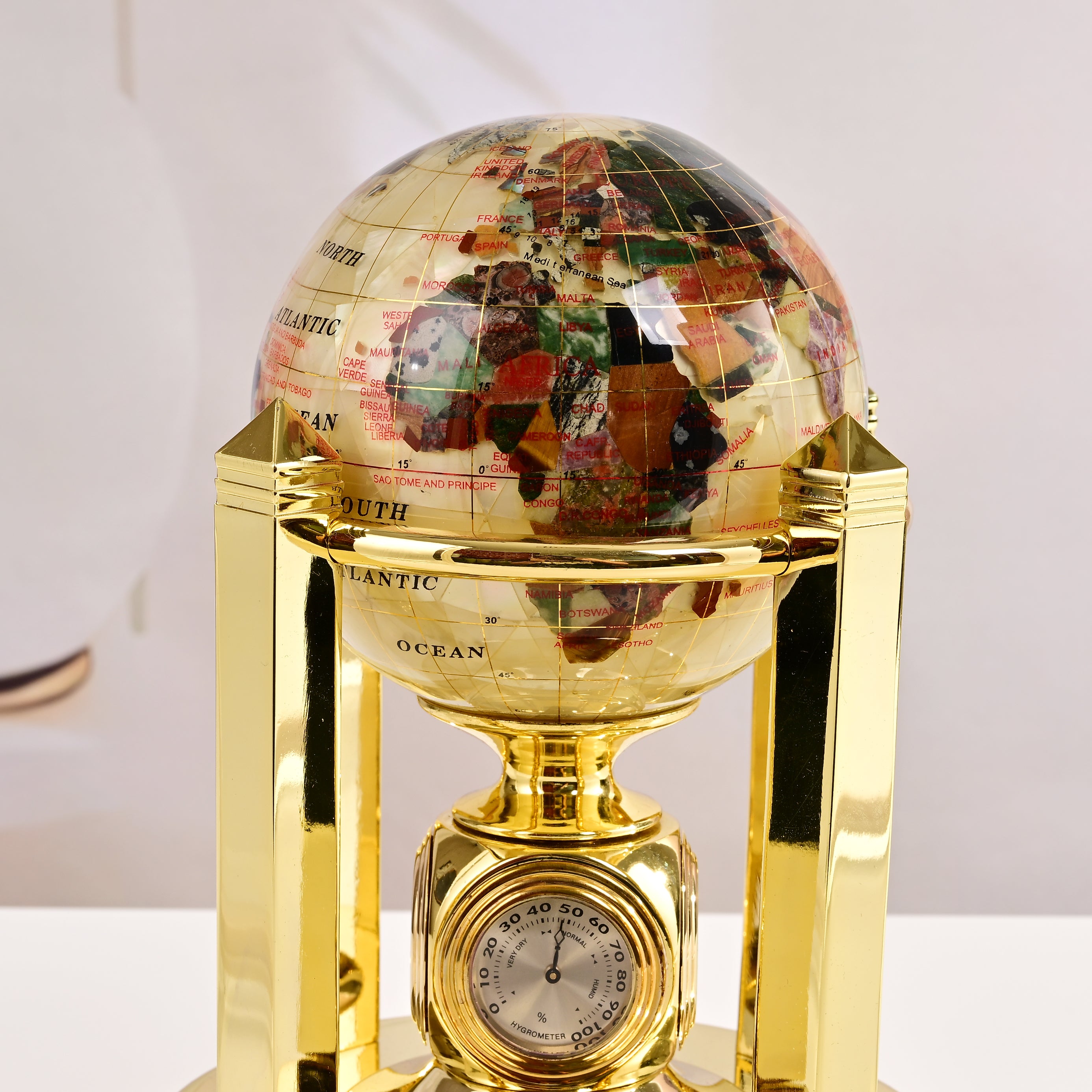 8.5" Tall Gemstone Globe with 5" Mother of Pearl Diamond Cut Ocean on 24k Gold Plated Bi-directional rotating Stand