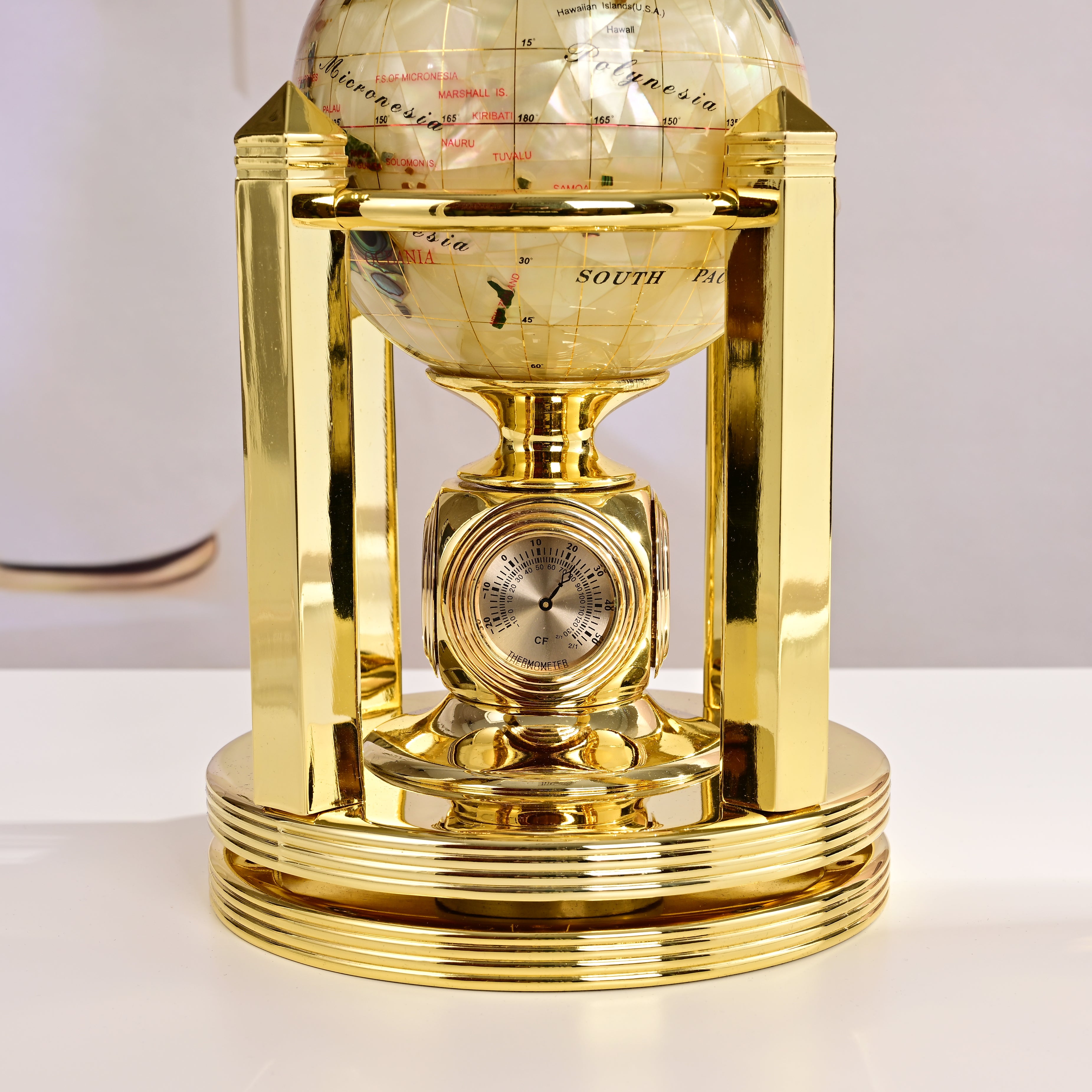 8.5" Tall Gemstone Globe with 5" Mother of Pearl Diamond Cut Ocean on 24k Gold Plated Bi-directional rotating Stand