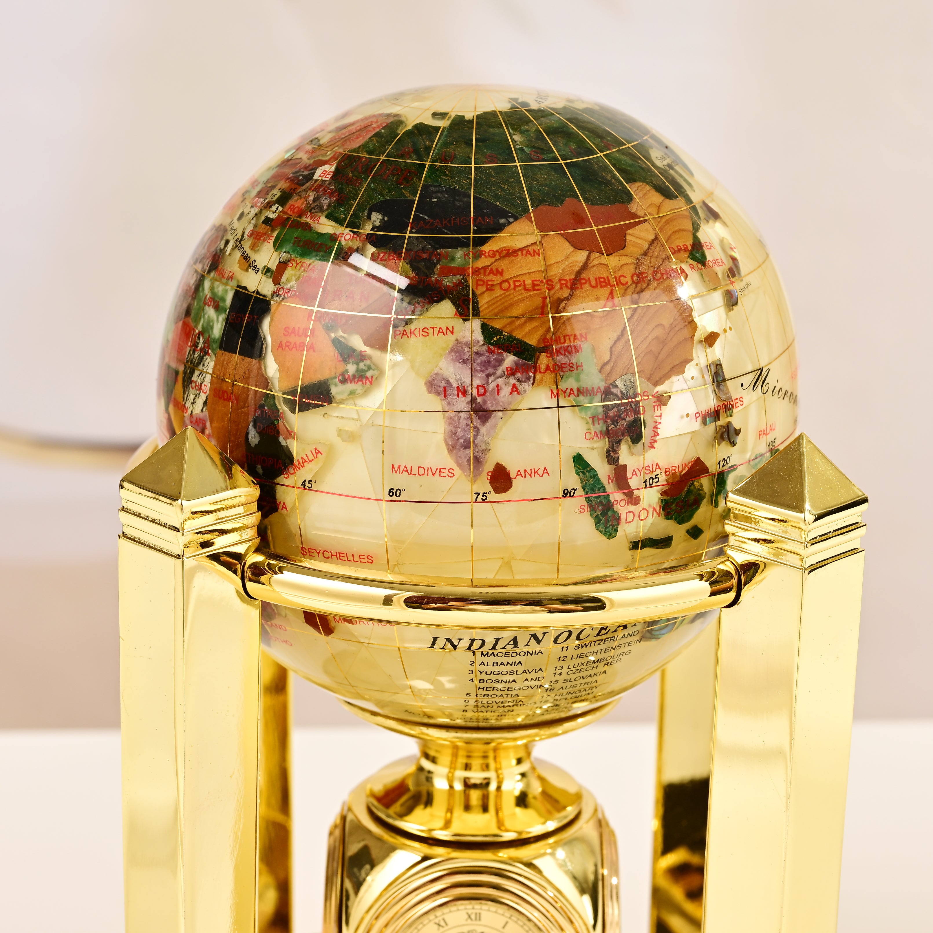 8.5" Tall Gemstone Globe with 4" Mother of Pearl Diamond Cut Ocean on 24k Gold Plated Bi-directional rotating Stand