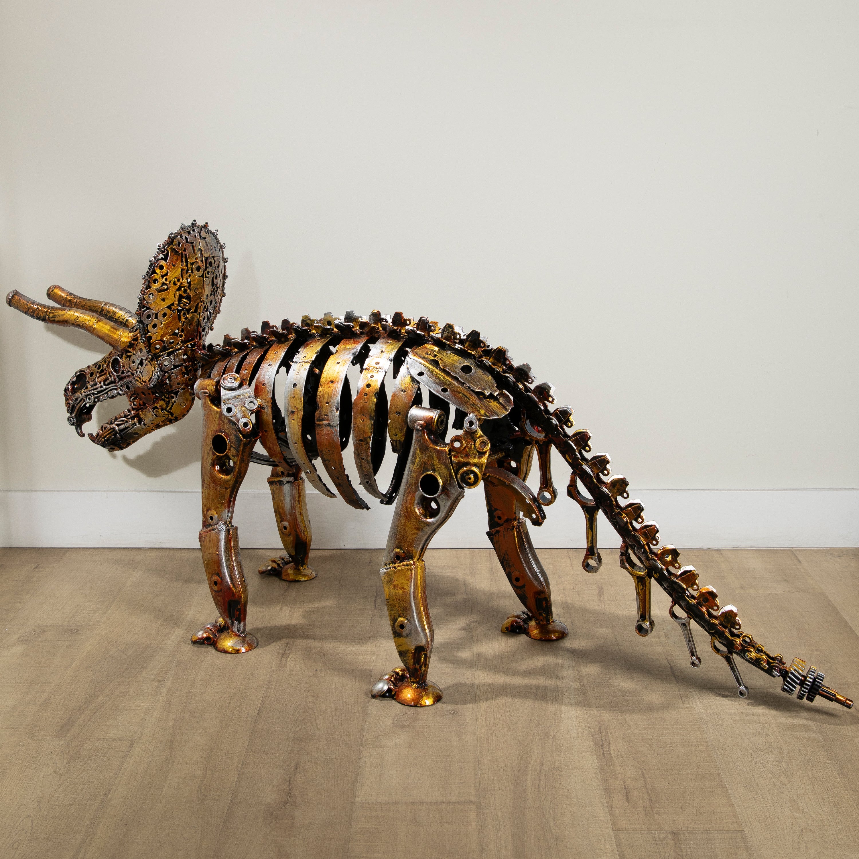 Gold Triceratops Skeleton Inspired Recycled Metal Sculpture