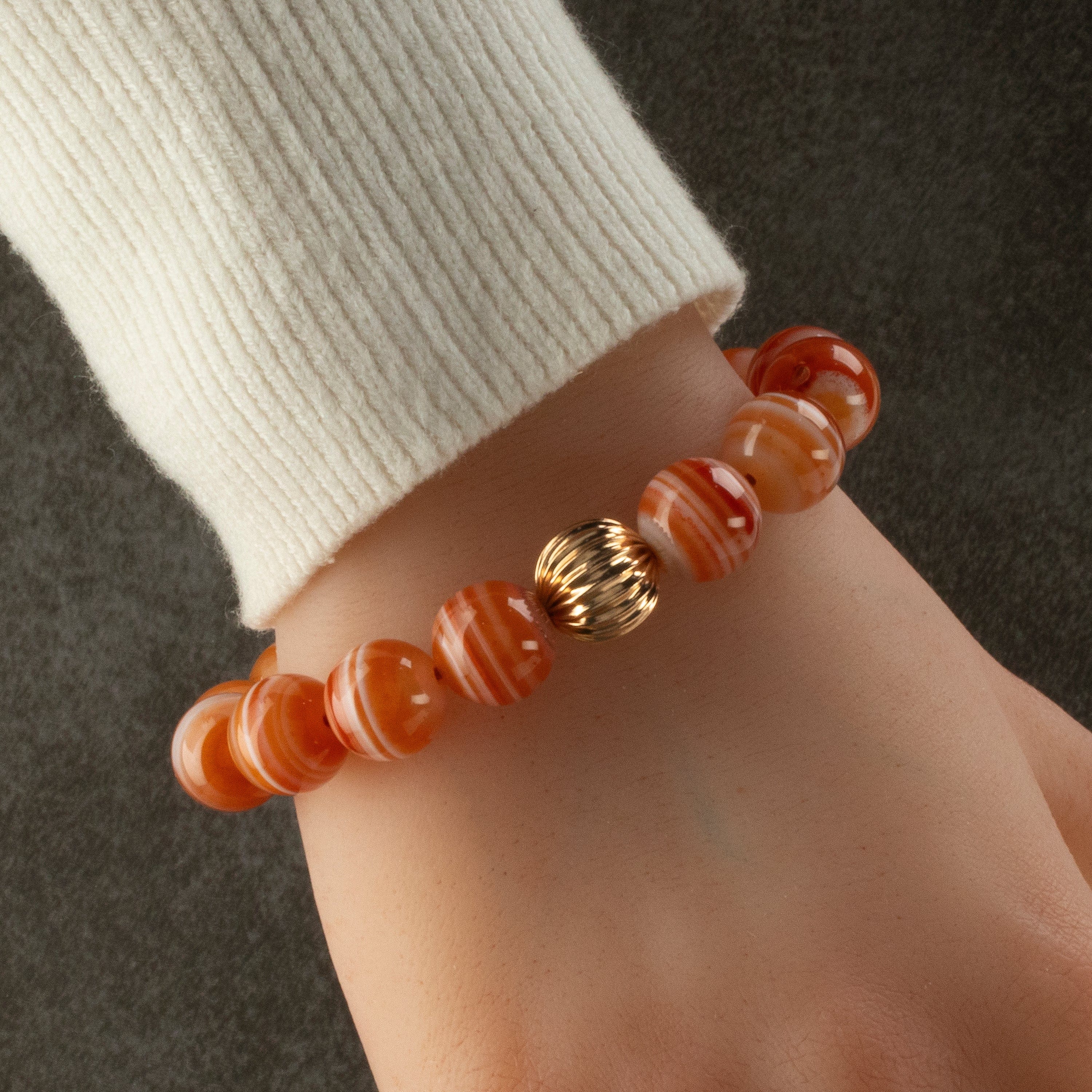 Polished Banded Carnelian 12mm Gemstone Bead Elastic Bracelet with Gold Accent Bead