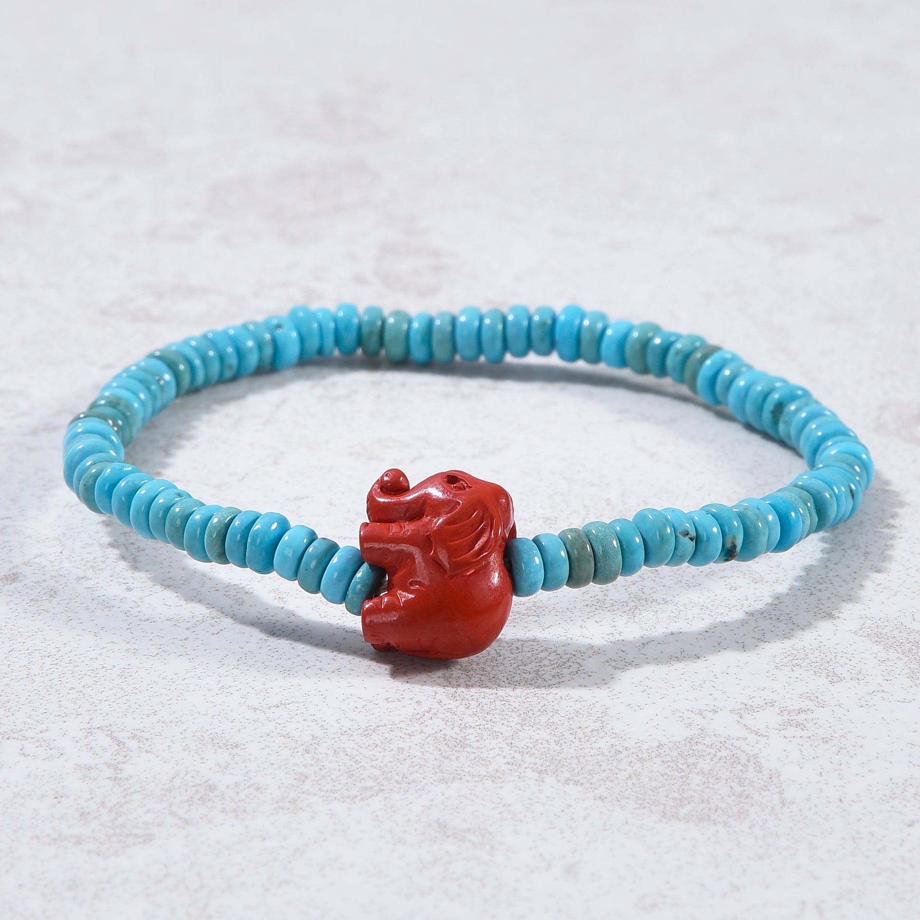 Kalifano Gemstone Bracelets Howlite Turquoise 2x4mm Elastic Gemstone Bracelet with Cinnabar Elephant