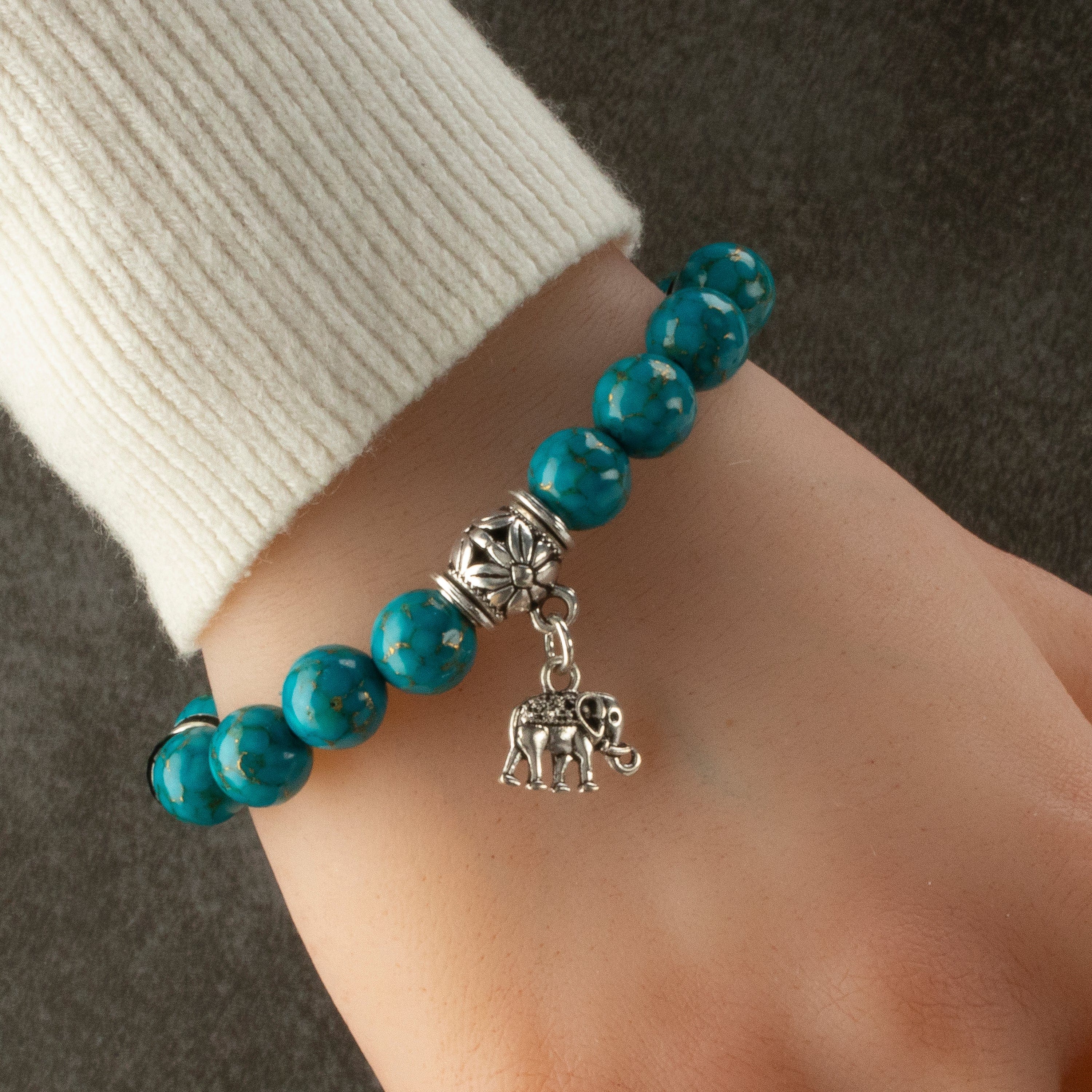 Kalifano Gemstone Bracelets Turquoise 10mm Gemstone Elastic Bead Bracelet with Elephant Accent Bead RED-BGP-074