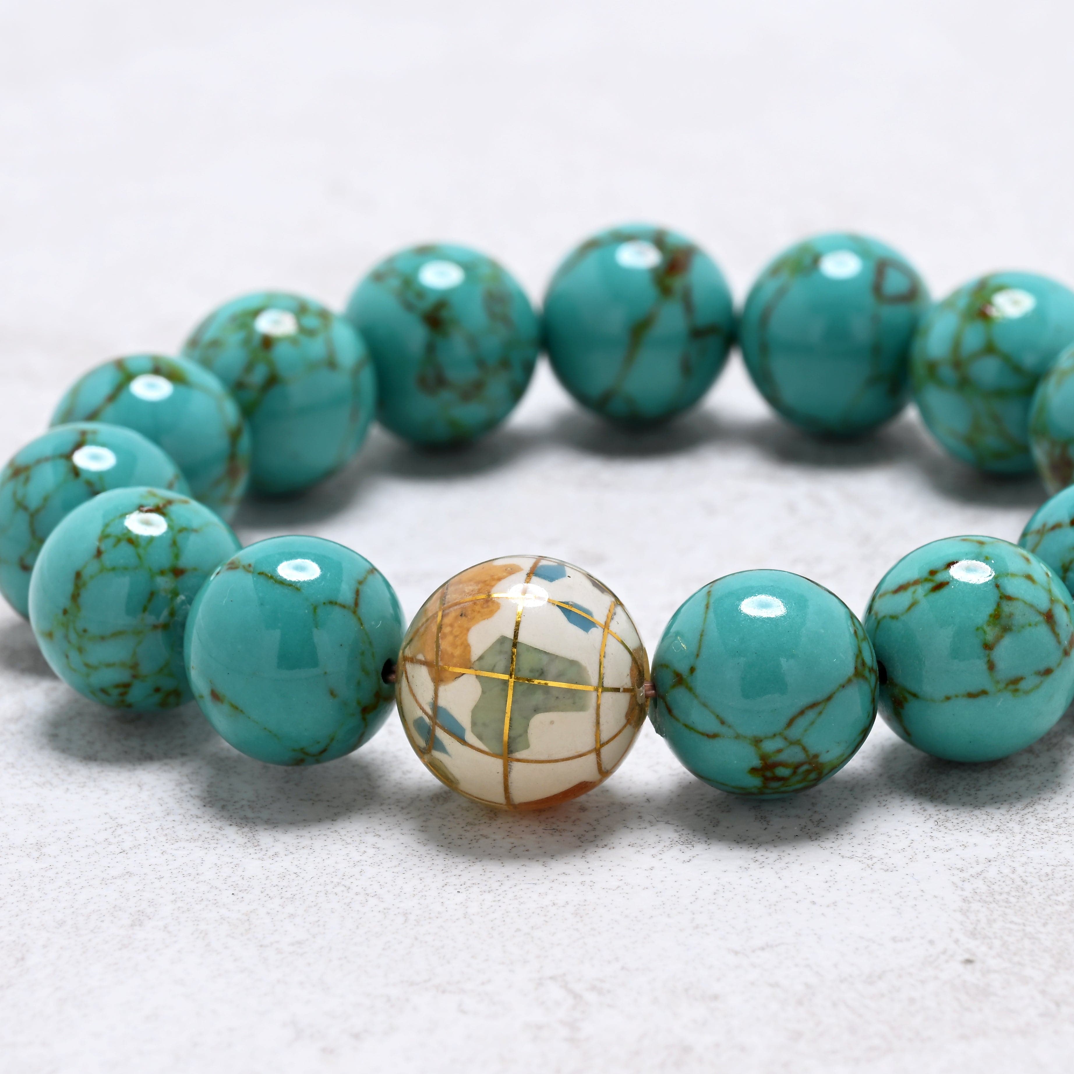 KALIFANO Gemstone Jewelry 14mm Howlite Turquoise Gemstone Elastic Bracelet with White Globe Accent Bead