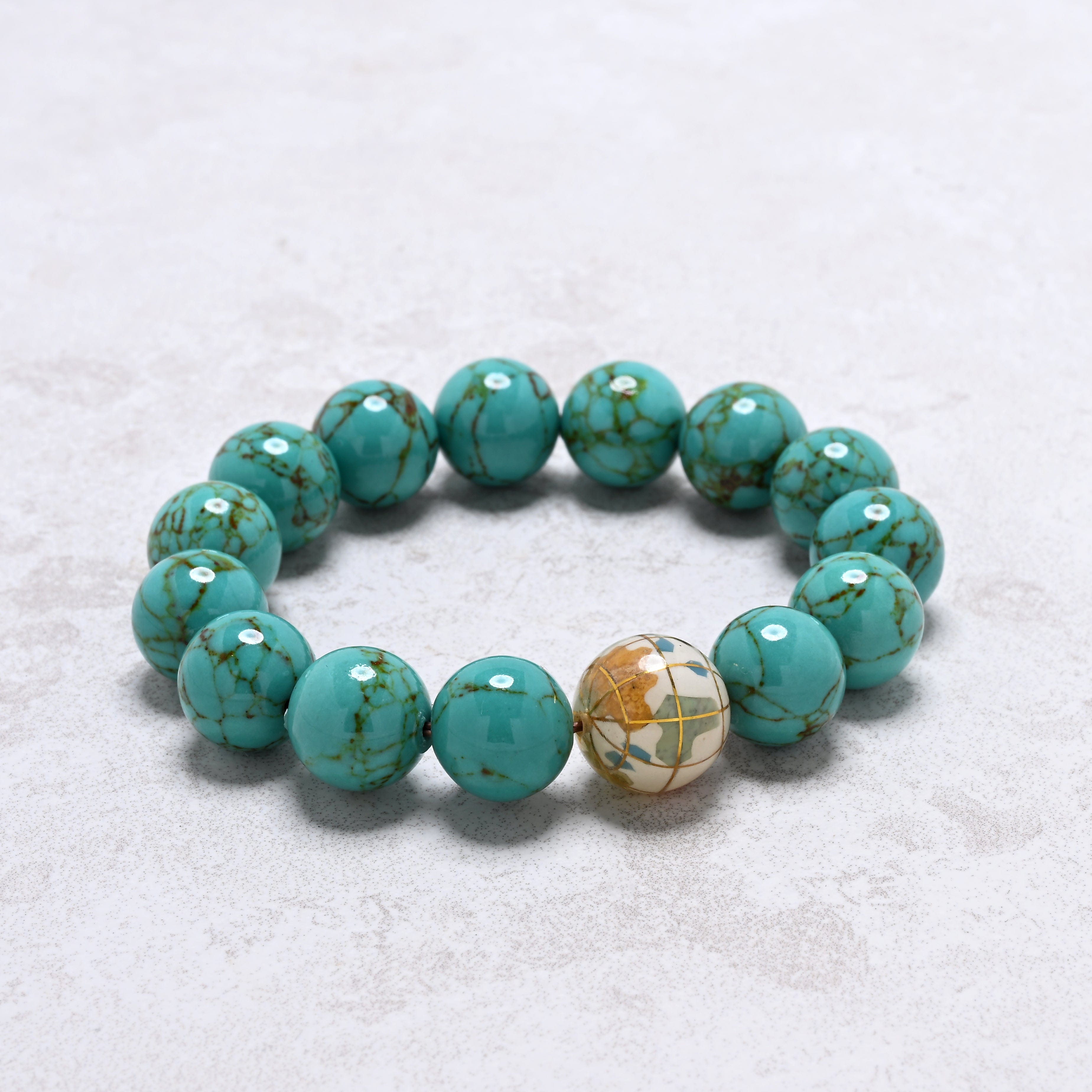 KALIFANO Gemstone Jewelry 14mm Howlite Turquoise Gemstone Elastic Bracelet with White Globe Accent Bead