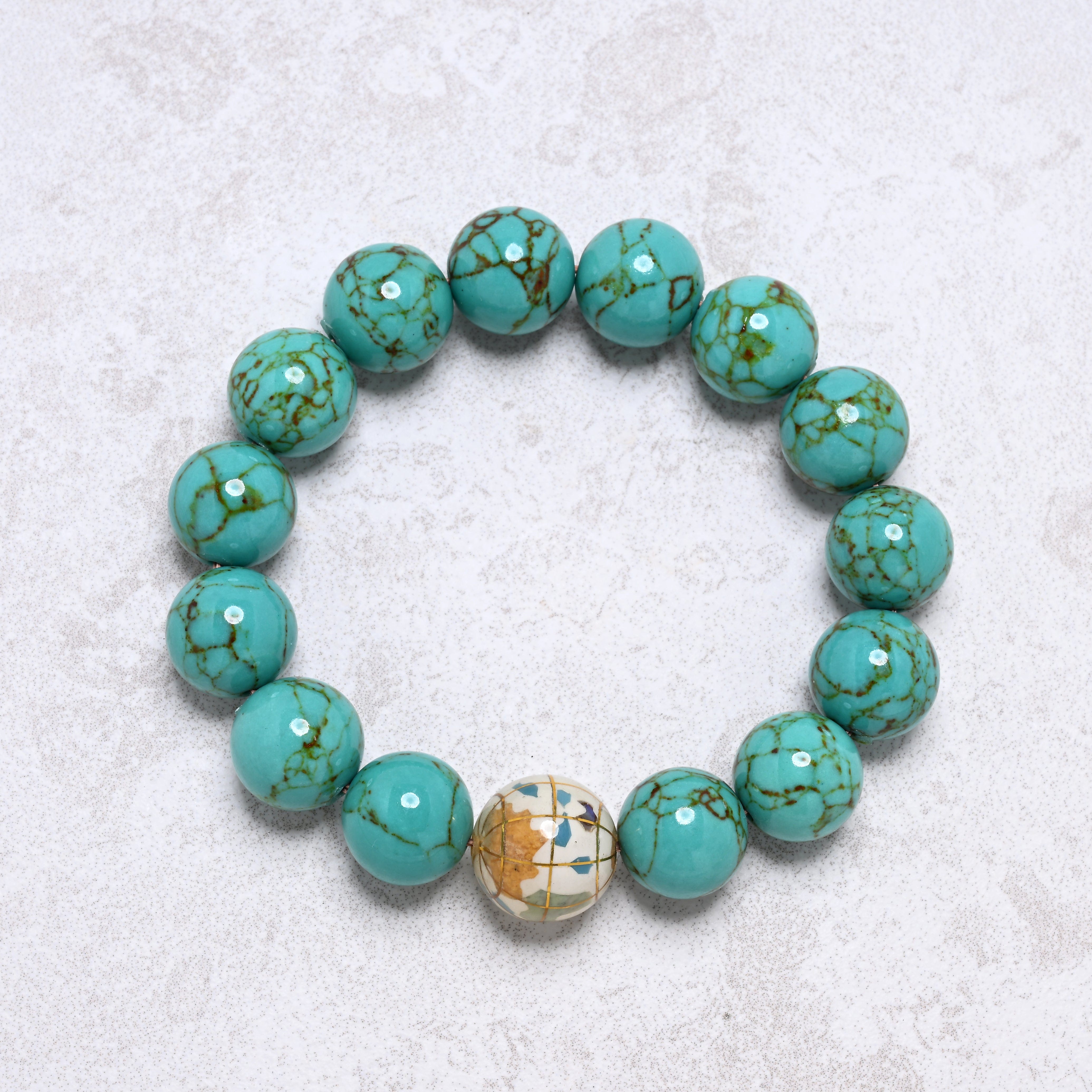 KALIFANO Gemstone Jewelry 14mm Howlite Turquoise Gemstone Elastic Bracelet with White Globe Accent Bead