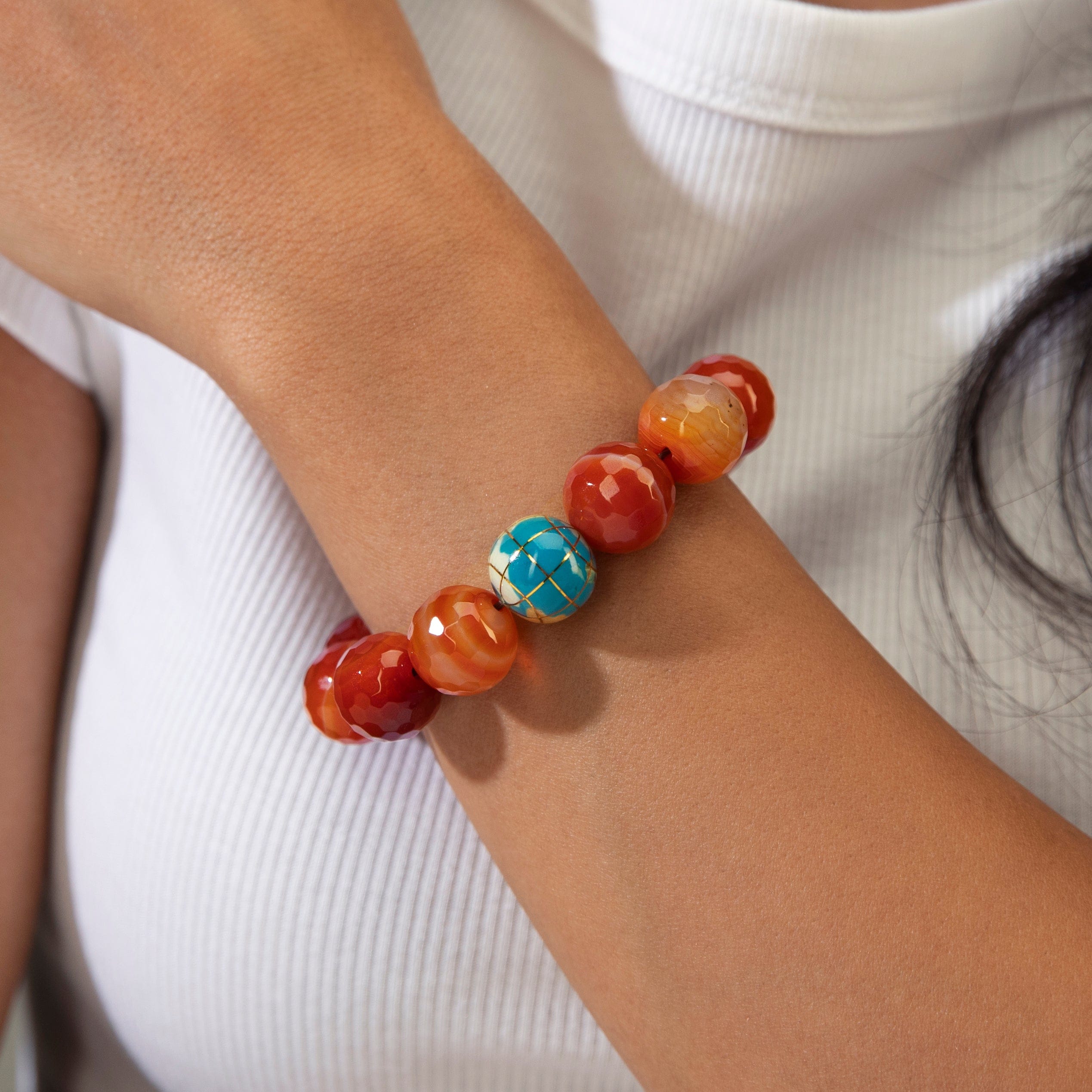 KALIFANO Gemstone Jewelry 16mm Carnelian Gemstone Elastic Bracelet with Blue Globe Accent Bead