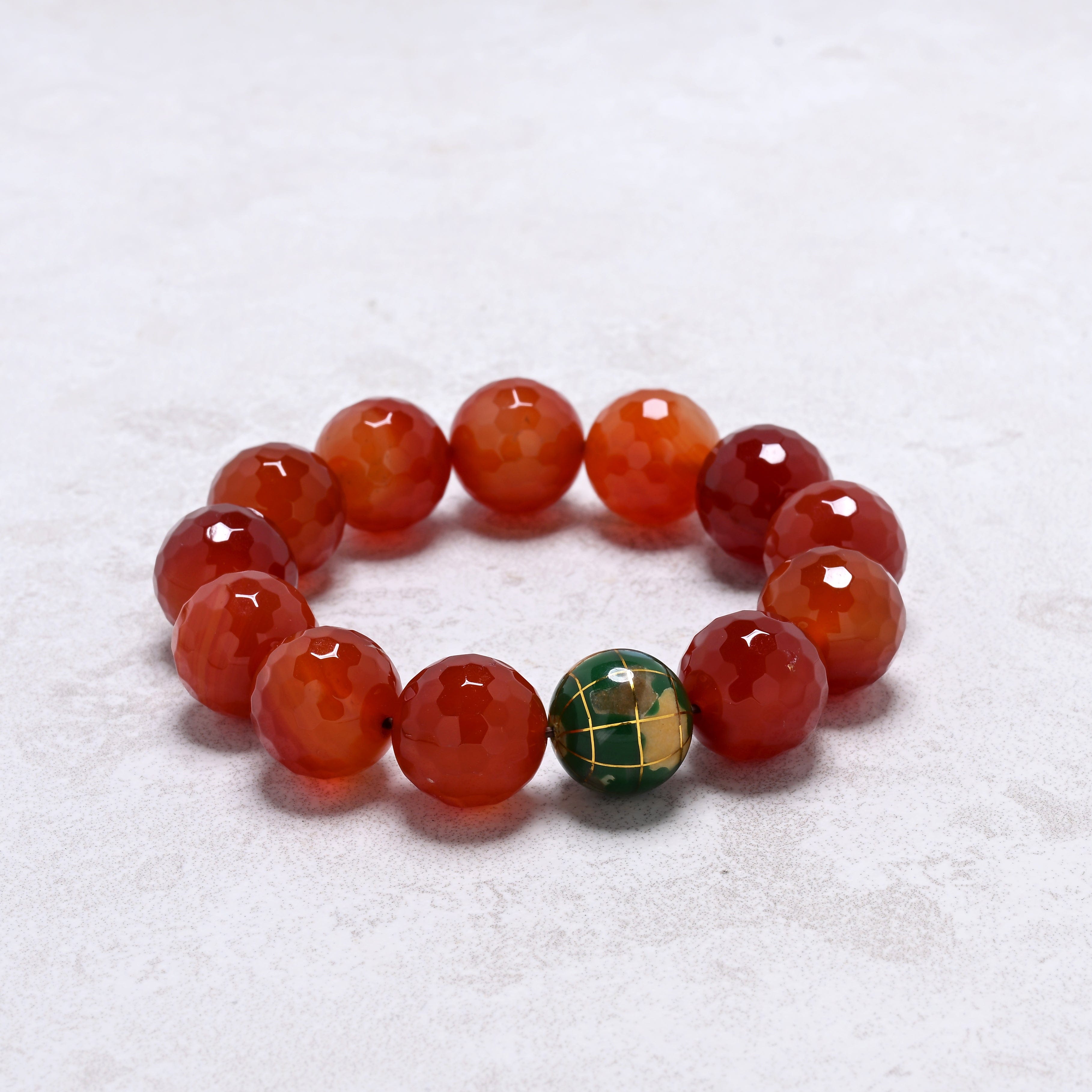 KALIFANO Gemstone Jewelry 16mm Carnelian Gemstone Elastic Bracelet with Green Globe Accent Bead