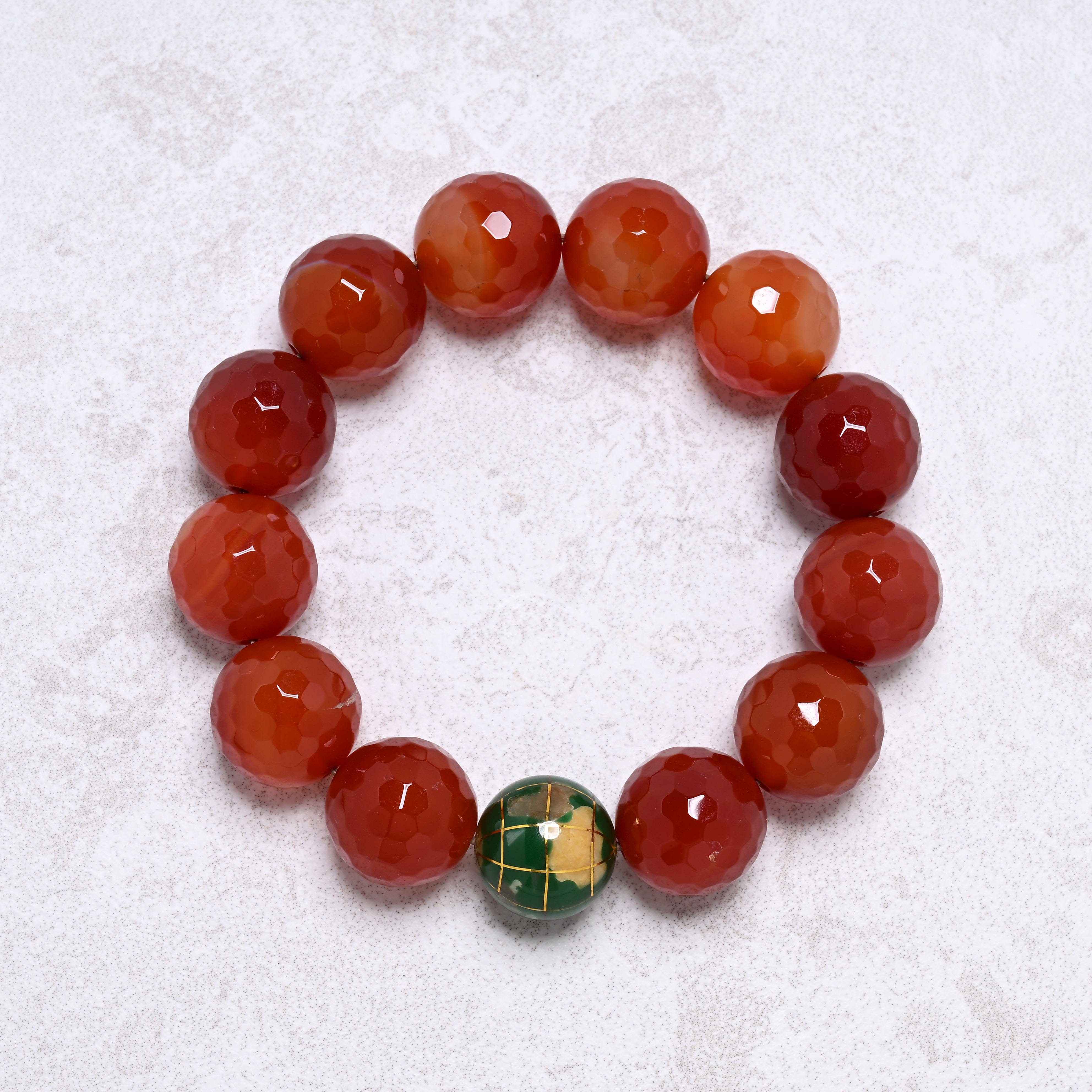 KALIFANO Gemstone Jewelry 16mm Carnelian Gemstone Elastic Bracelet with Green Globe Accent Bead