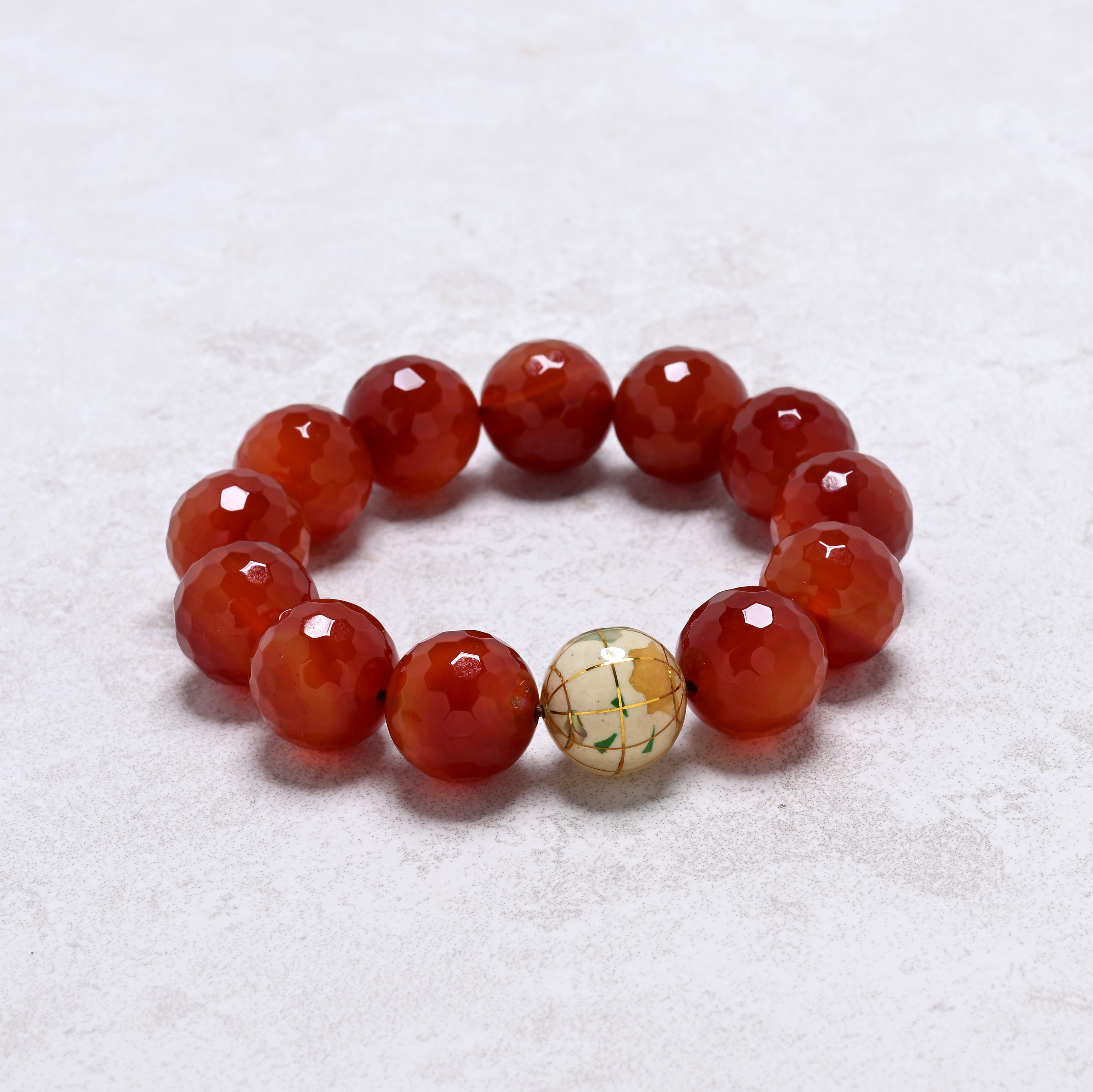 KALIFANO Gemstone Jewelry 16mm Carnelian Gemstone Elastic Bracelet with White Globe Accent Bead