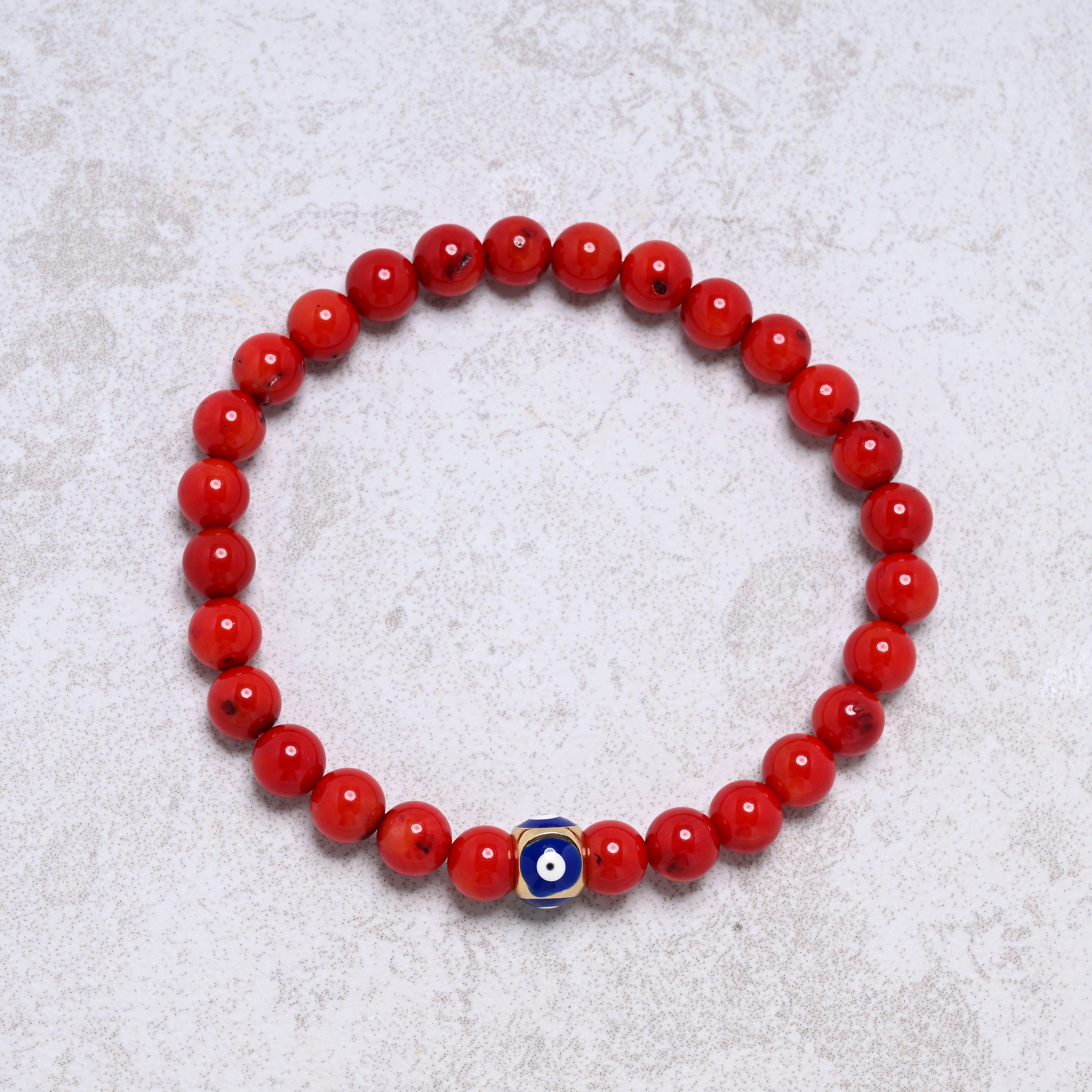 KALIFANO Gemstone Jewelry 6.3" Elastic 6mm Genuine Coral Beaded Bracelet with Vintage Evil Eye 8mm Navy Bead NB-004-NVRC-S