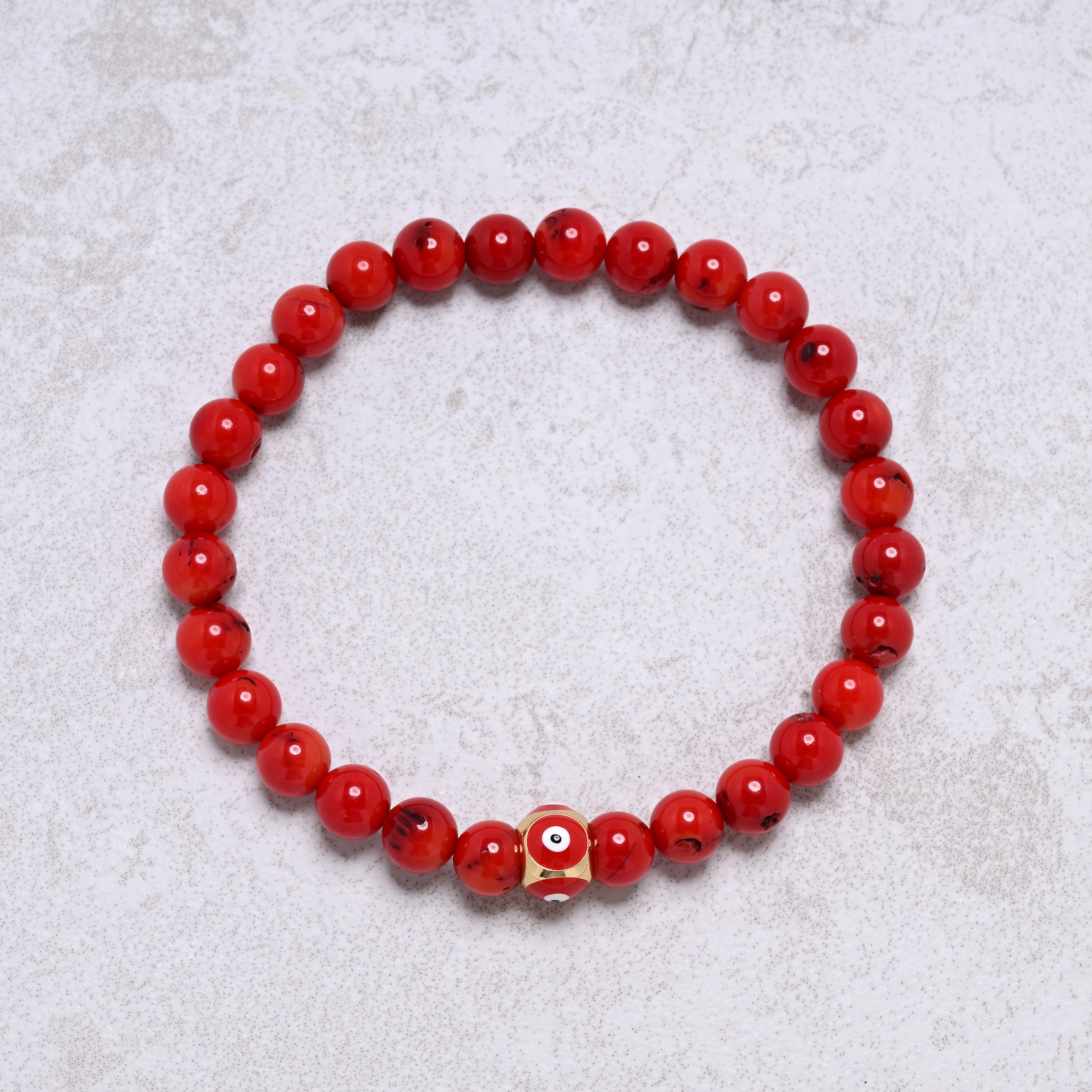KALIFANO Gemstone Jewelry 6.3" Elastic 6mm Genuine Coral Beaded Bracelet with Vintage Evil Eye 8mm Red Bead NB-004-RDRC-S