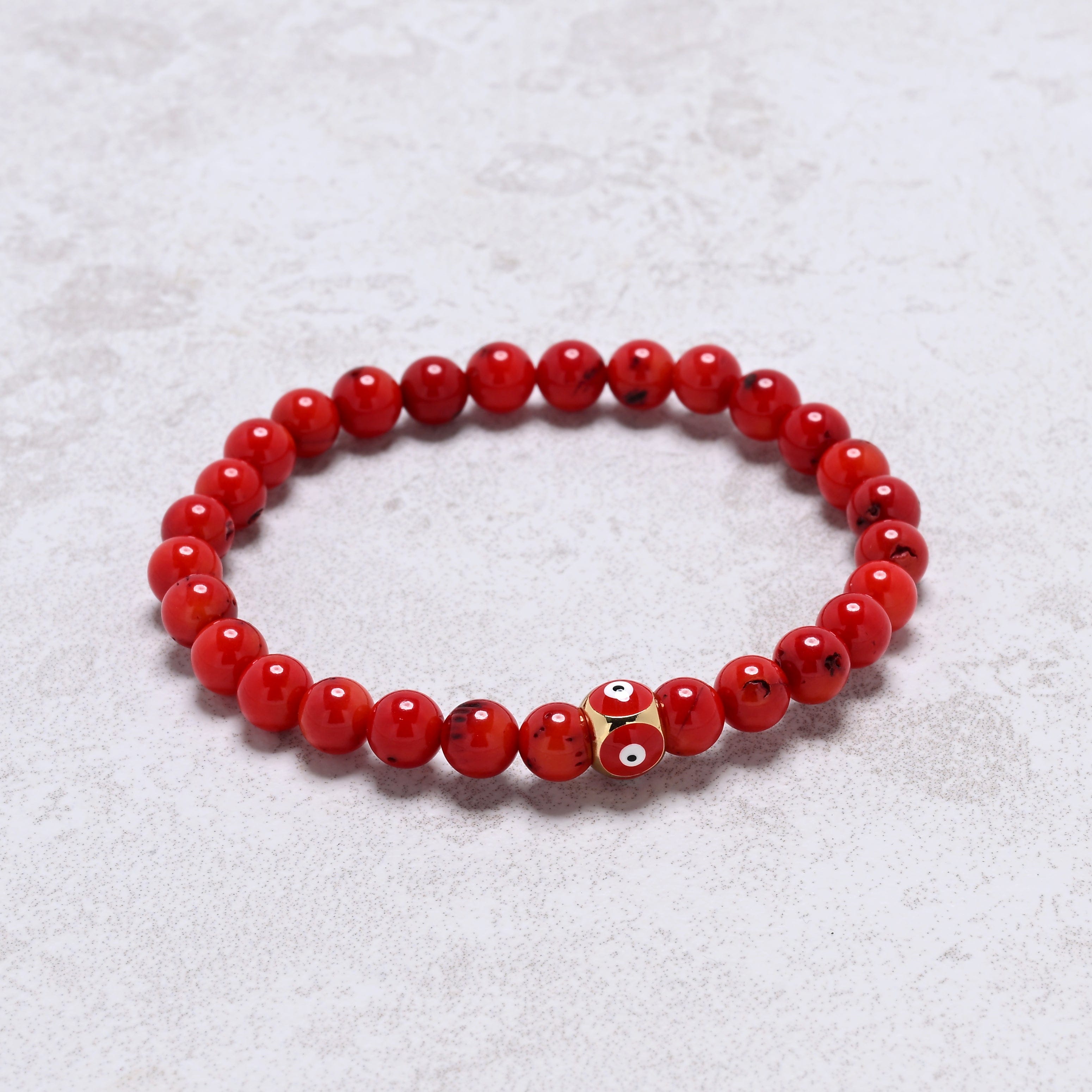 KALIFANO Gemstone Jewelry 6.3" Elastic 6mm Genuine Coral Beaded Bracelet with Vintage Evil Eye 8mm Red Bead NB-004-RDRC-S
