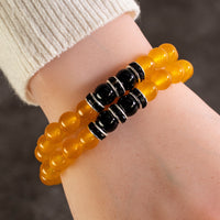 Yellow Agate 8mm Beads with Black Agate and Black and Silver Accent Beads Double Wrap Elastic Gemstone Bracelet Main Image
